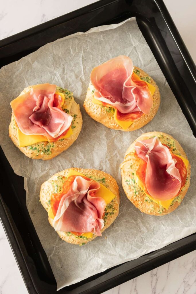 Hearty Breakfast Bagel with Egg, Prosciutto, and Garlic Butter