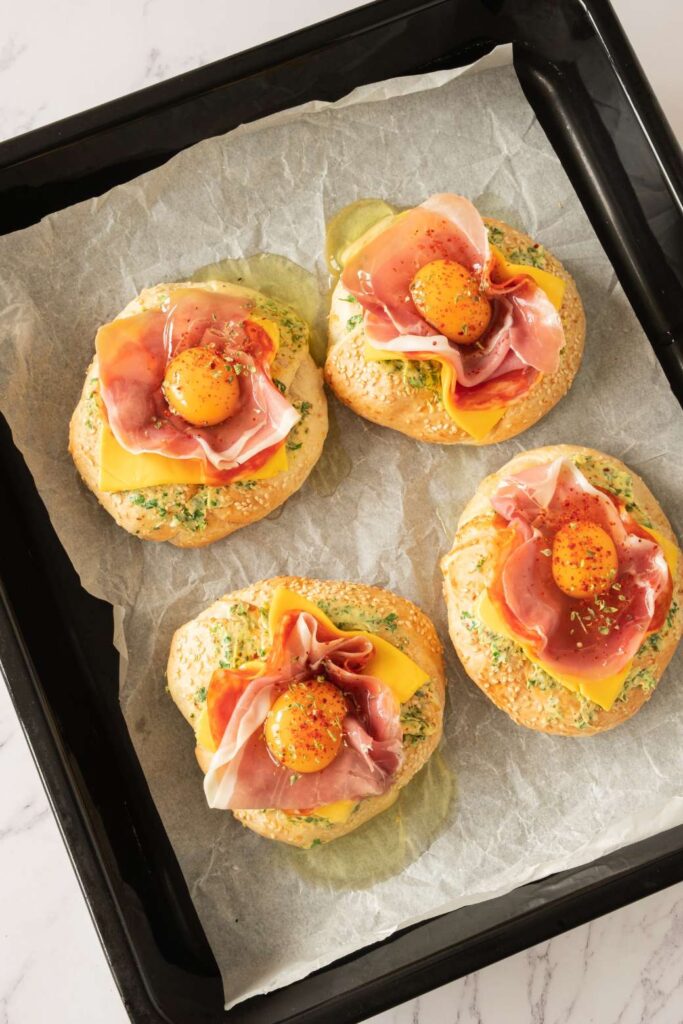 Hearty Breakfast Bagel with Egg, Prosciutto, and Garlic Butter