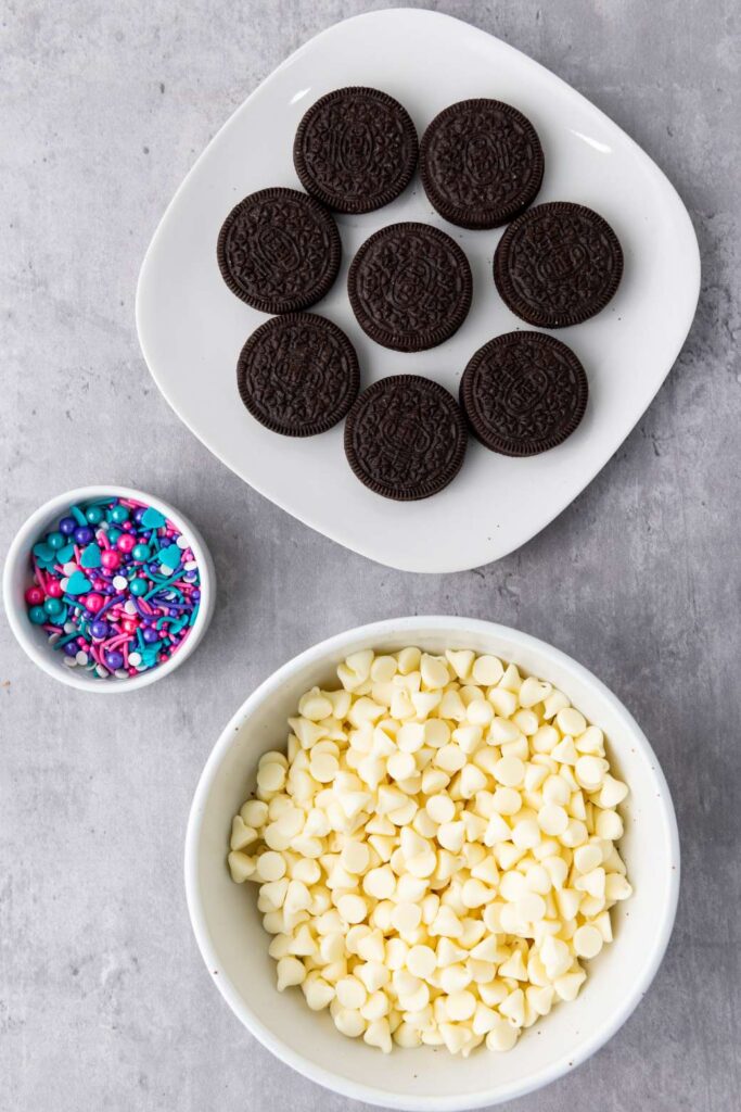 Q: Can I use dark chocolate instead of white chocolate for dipping?
A: Yes, you can absolutely use dark chocolate, milk chocolate, or even a mix depending on your preference!

Q: How long do the chocolate covered Oreos need to chill in the fridge?
A: The chocolate will need about 30 minutes to set in the fridge before they’re ready to eat.

Q: What kind of sprinkles work best for decorating?
A: You can use any sprinkles you like! Colorful sugar sprinkles, chocolate sprinkles, or even themed sprinkles for holidays or parties all work well.

Q: Do I need an Oreo mold for this recipe?
A: No, a mold isn’t required. You can simply dip each Oreo into the melted chocolate using a fork or spoon, then sprinkle or decorate as desired.

Q: Can I use a different type of cookie for this recipe?
A: Absolutely! While Oreos are classic, you can use any cookie you like. Just be sure the cookie is sturdy enough to hold up to dipping.

Q: Can I make these ahead of time?
A: Yes, you can make them a day or two in advance. Just store them in an airtight container in the fridge until ready to serve.

Q: Can I add flavored extracts to the chocolate for extra flavor?
A: Yes, feel free to experiment! A little vanilla extract or mint extract would pair well with the chocolate.

Q: How do I melt the white chocolate without burning it?
A: Melt the white chocolate in 30-second intervals in the microwave, stirring after each interval. Alternatively, you can melt it using a double boiler on the stovetop.

Q: Can I freeze these chocolate covered Oreos?
A: Yes! These Oreos freeze well. Just place them in an airtight container or freezer bag and store for up to 3 months.

Q: Do I need to add any additional flavor to the chocolate coating?
A: The chocolate is delicious on its own, but you can always add flavorings like orange zest, coffee powder, or spices like cinnamon if you want to switch it up.

Q: What is the best way to store leftover chocolate covered Oreos?
A: Store the leftover Oreos in an airtight container at room temperature for up to a week or refrigerate them to extend freshness.

Q: Can I use chocolate chips instead of melting chocolate?
A: Yes, chocolate chips can work, but they can sometimes be a bit thicker and harder to coat evenly. Just be sure to add a small amount of coconut oil or vegetable oil to thin them out if needed.